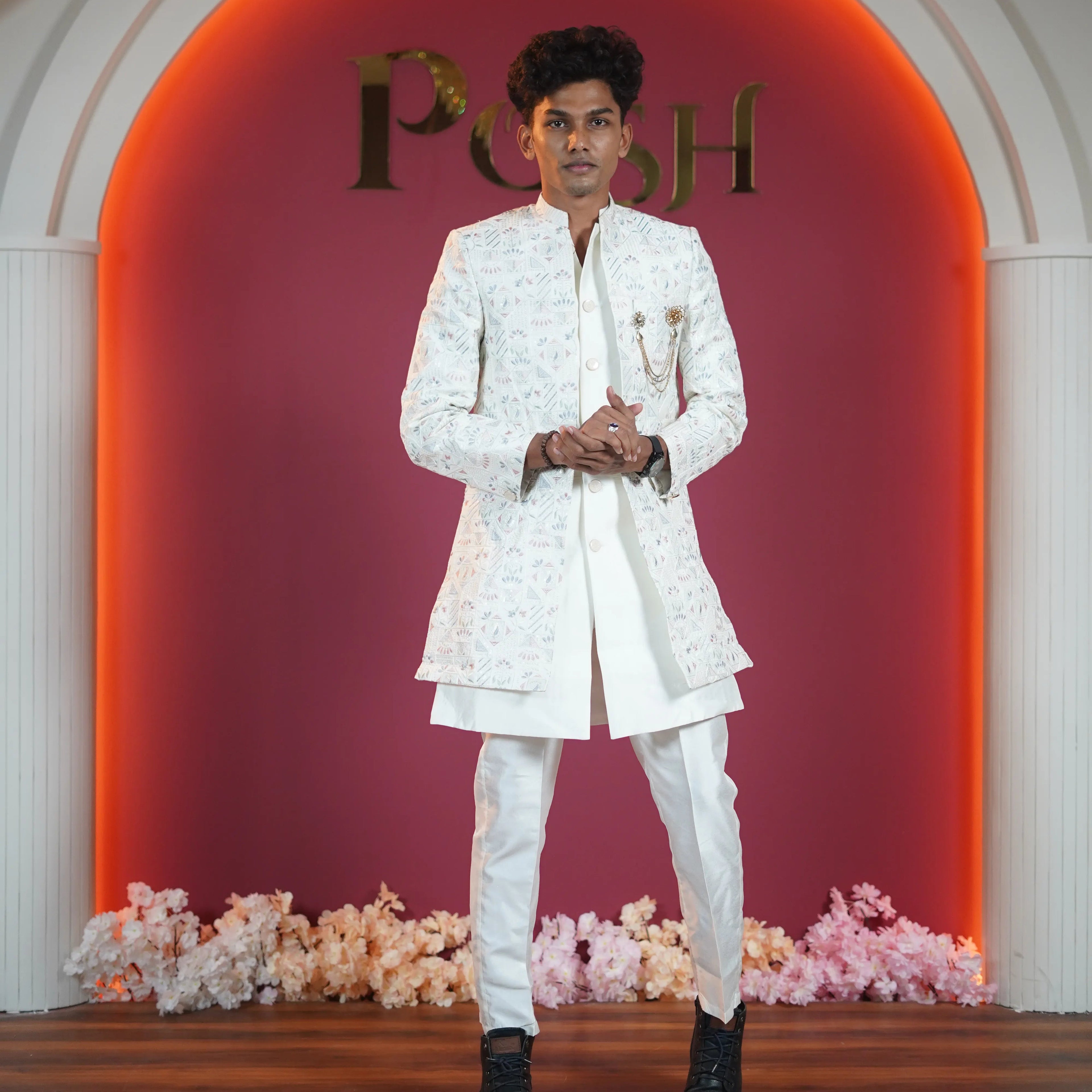 Ivory floral designer sherwani for groom available for rent at Posh Wedding Rental Kerala wedding dress rental