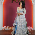 Elegant bride in pastel blue designer Anarkali with heavy silver embroidery from Posh Wedding Rentals premium collection.