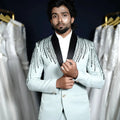 Pista green designer suit with black lapel for groom