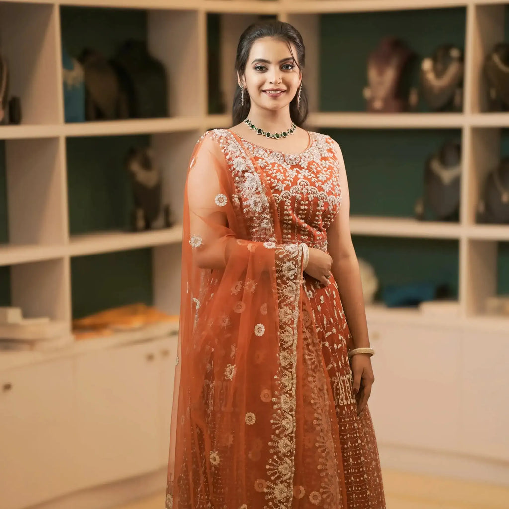 rust orange lehenga wedding dress rental kerala