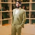 Premium sage green three-piece suit for men featuring a double-breasted waistcoat and tailored blazer. Elegant groom outfit for weddings, engagements, receptions, and pre-wedding events available at Posh Wedding Rental, Kerala.
