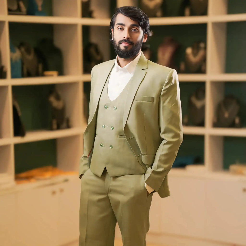 Luxury sage green groom suit with matching blazer, waistcoat, and trousers designed for modern weddings. Ideal wedding suit rental for grooms, groomsmen, and reception events in Kerala by Posh Wedding Rental.