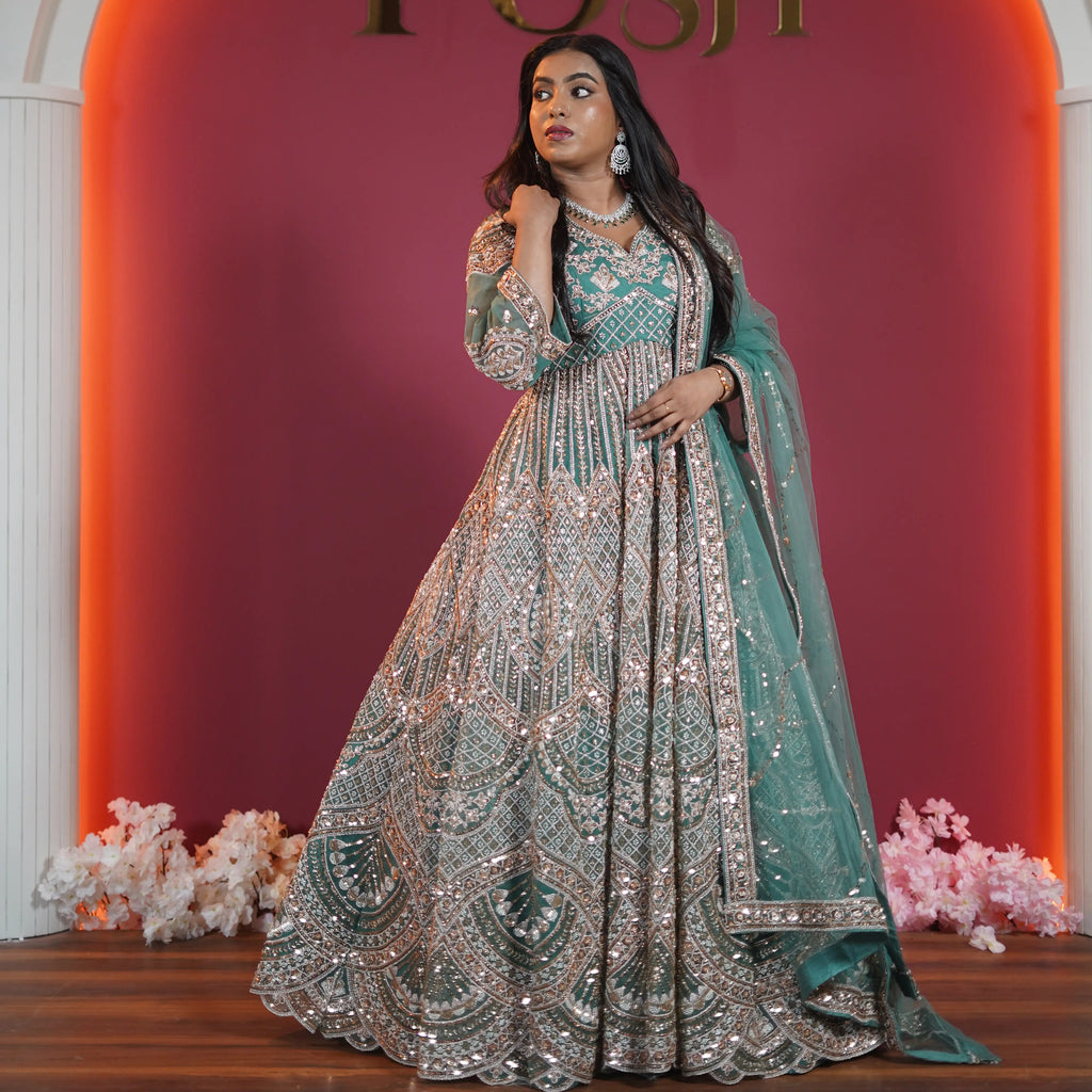 Teal green bridal Gown with heavy silver embroidery available on rent at Posh Wedding Rentals Kerala.