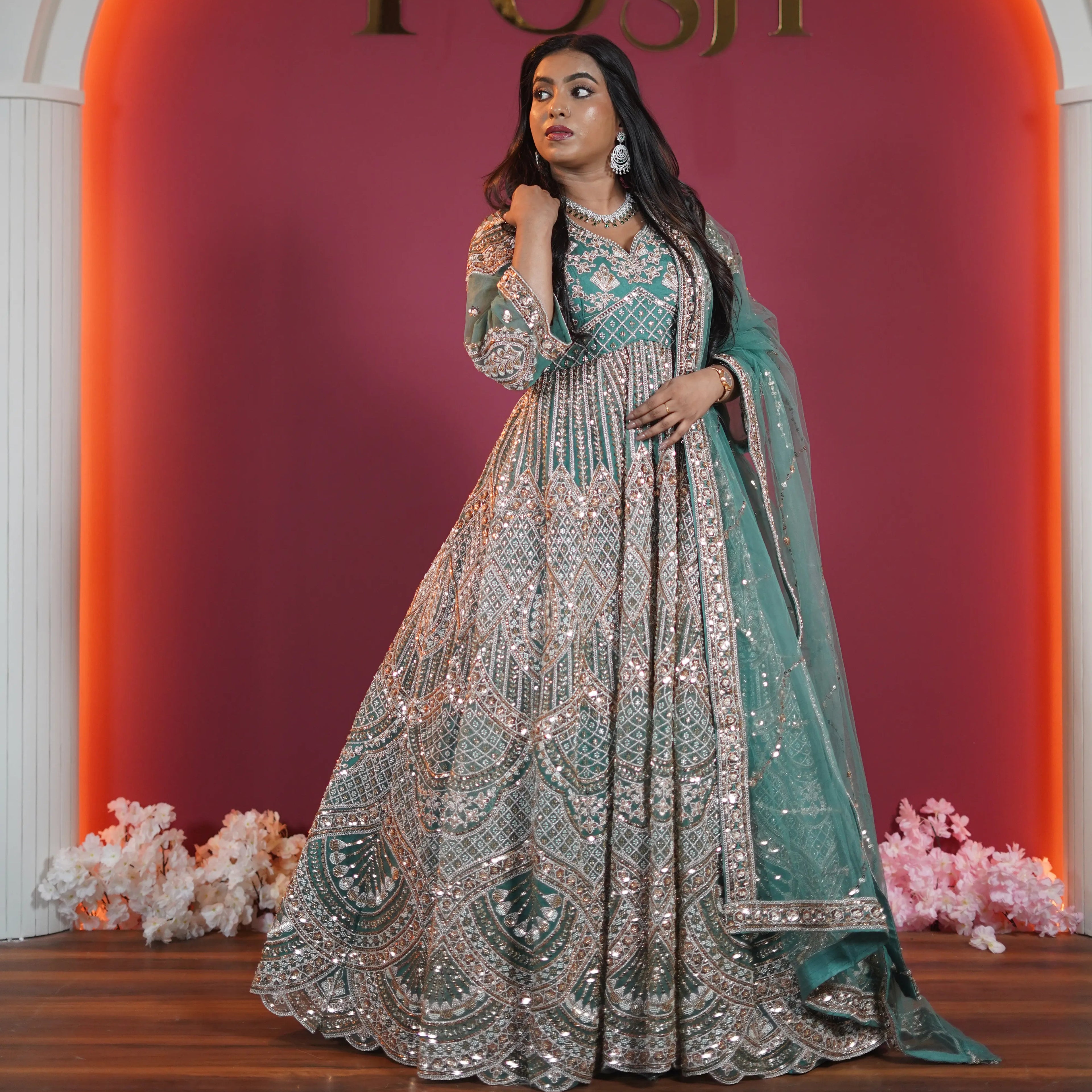 Teal green bridal Gown with heavy silver embroidery available on rent at Posh Wedding Rentals Kerala.