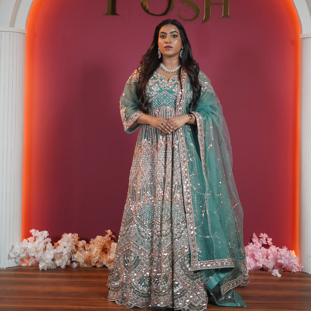 Teal green bridal Gown with heavy silver embroidery available on rent at Posh Wedding Rentals Kerala.