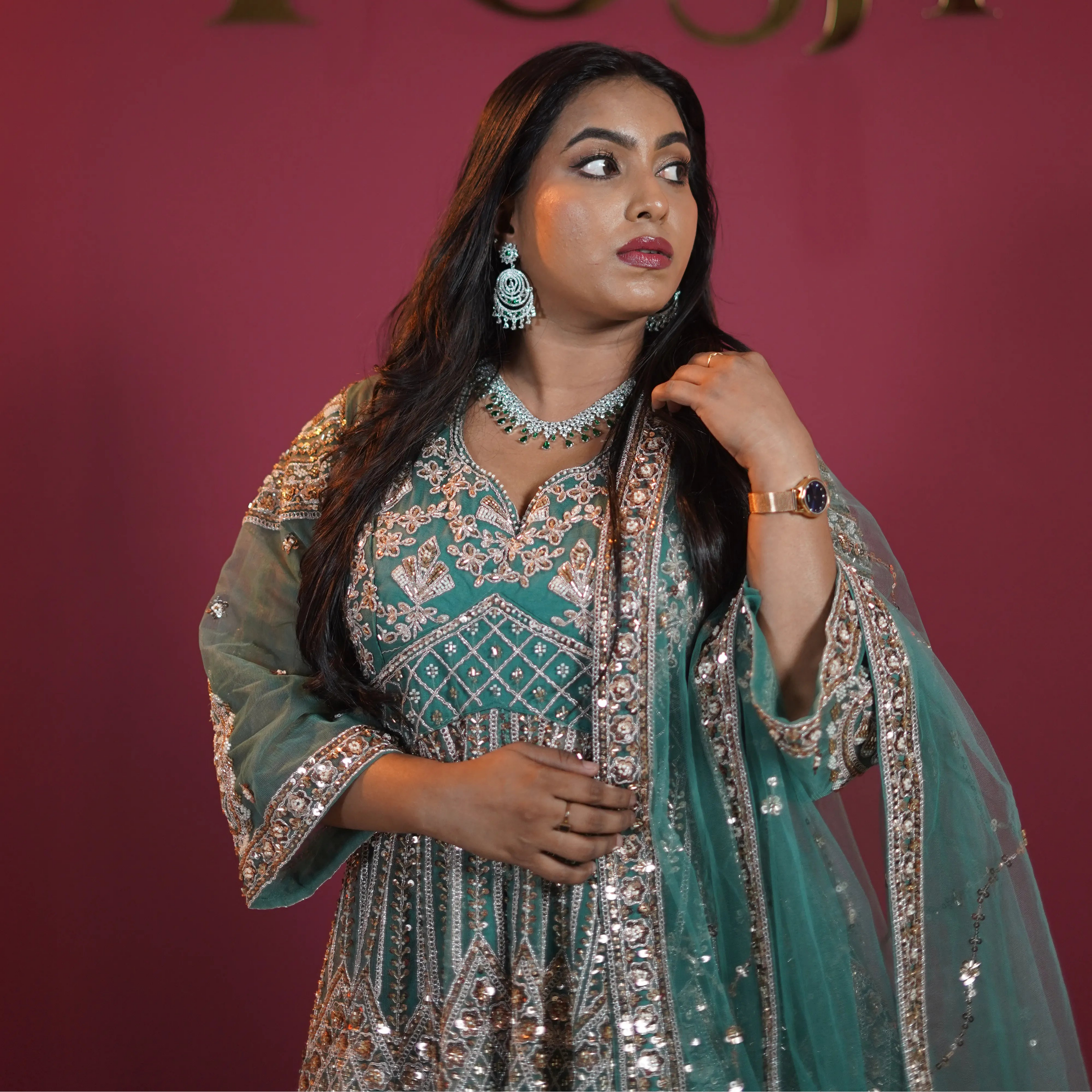 Teal green bridal Gown with heavy silver embroidery available on rent at Posh Wedding Rentals Kerala.