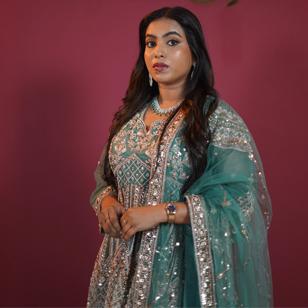 Teal green bridal Gown with heavy silver embroidery available on rent at Posh Wedding Rentals Kerala.