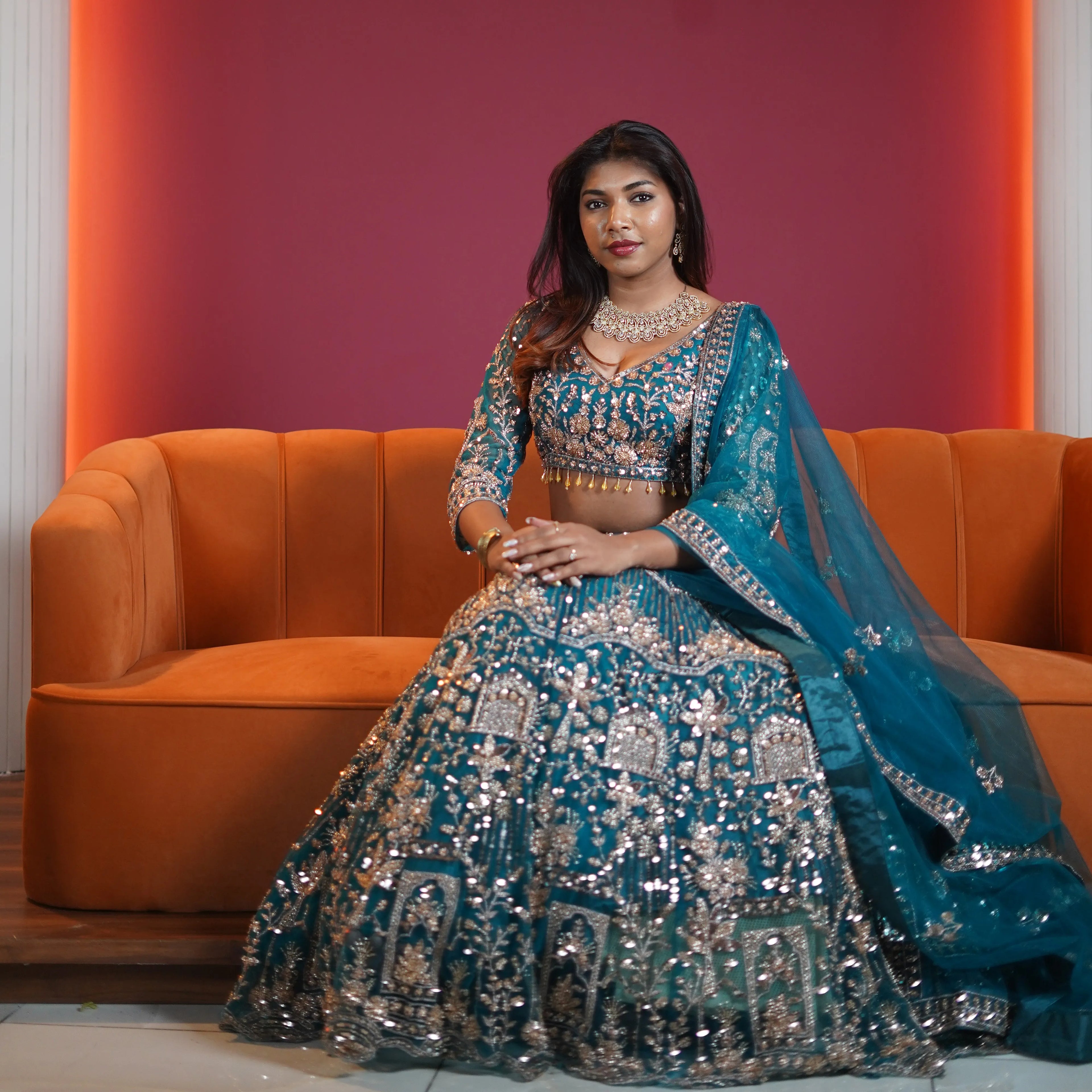 teal green embroidered bridal lehenga with silver zari work available at Posh Wedding Rental Kerala