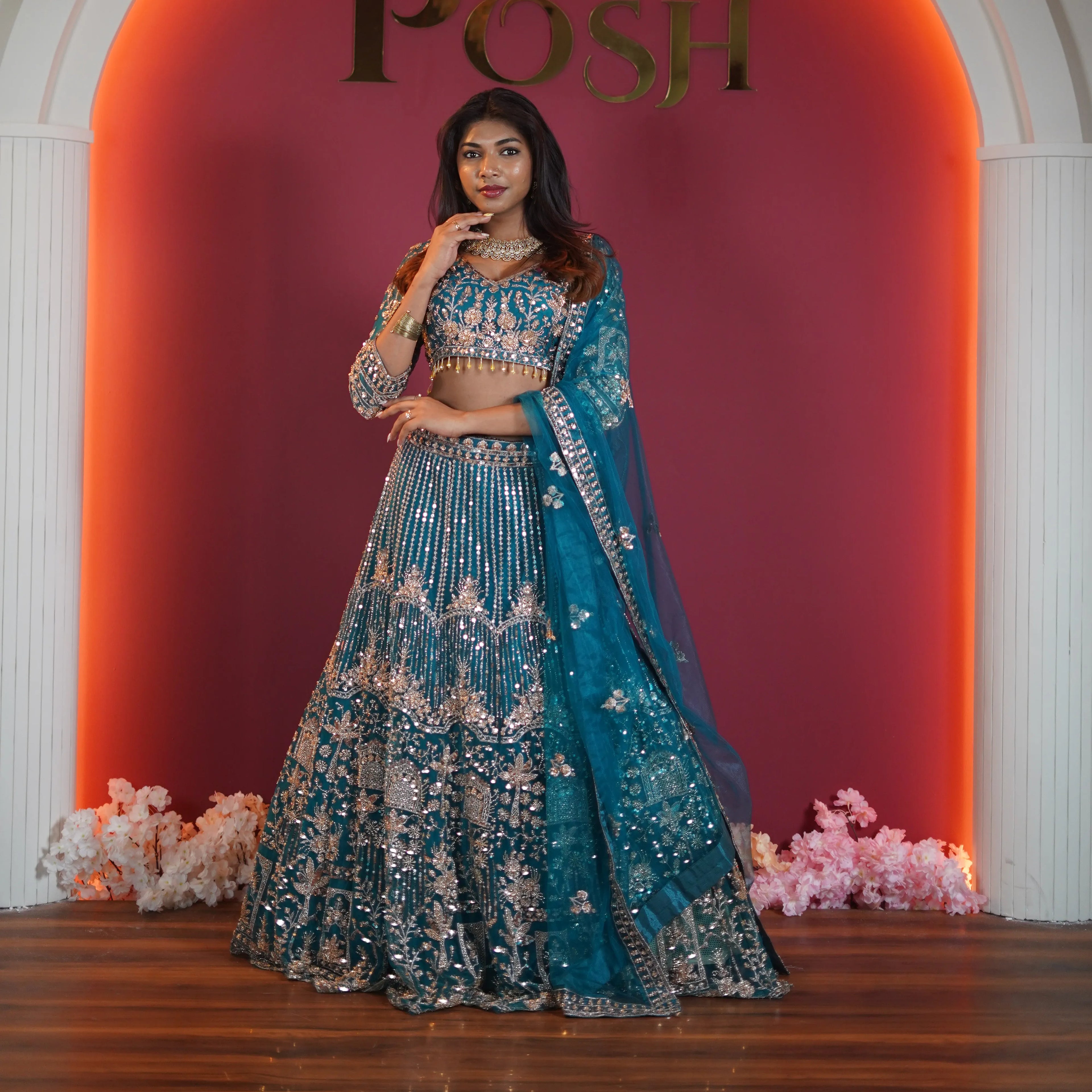 teal green embroidered bridal lehenga with silver zari work available at Posh Wedding Rental Kerala