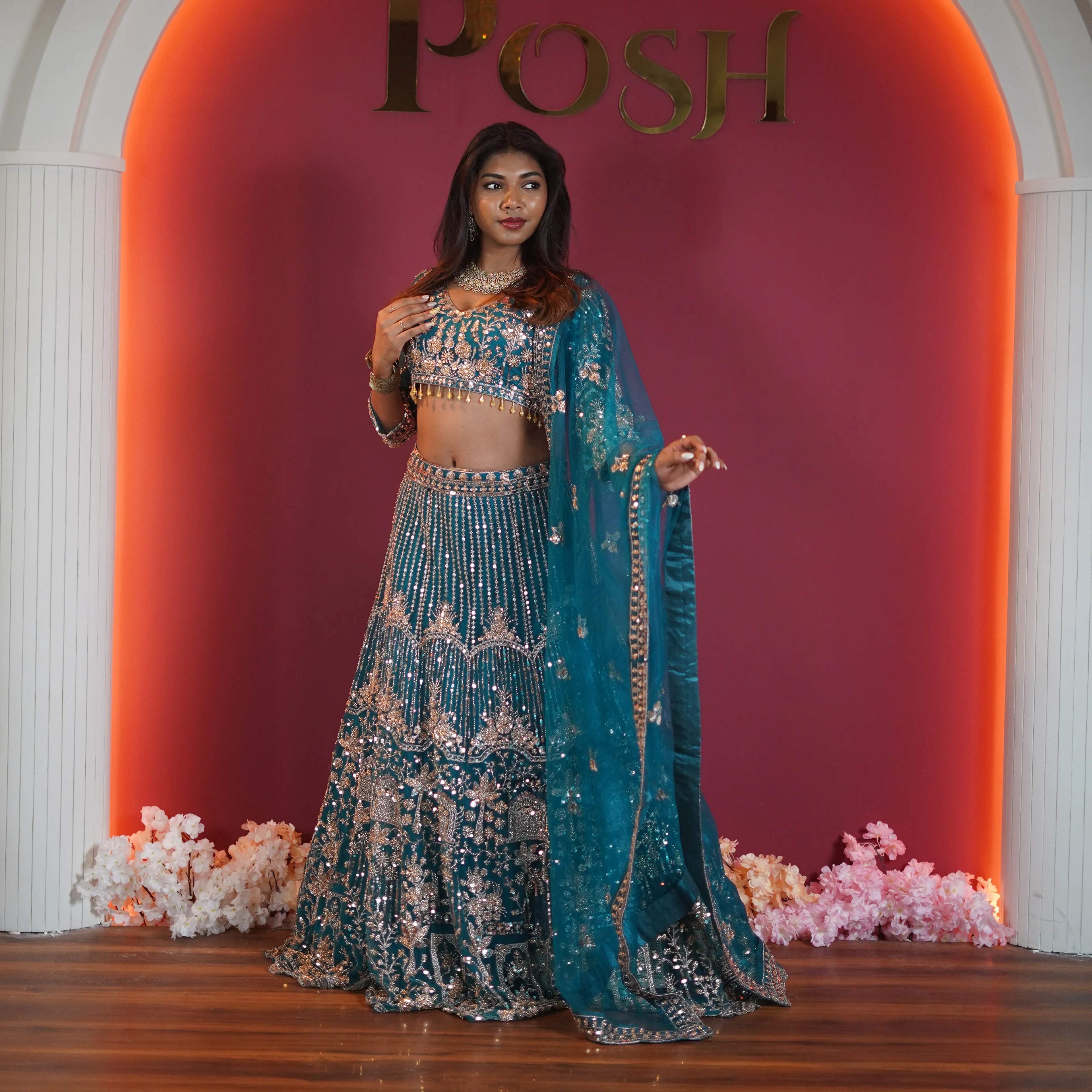 teal green embroidered bridal lehenga with silver zari work available at Posh Wedding Rental Kerala