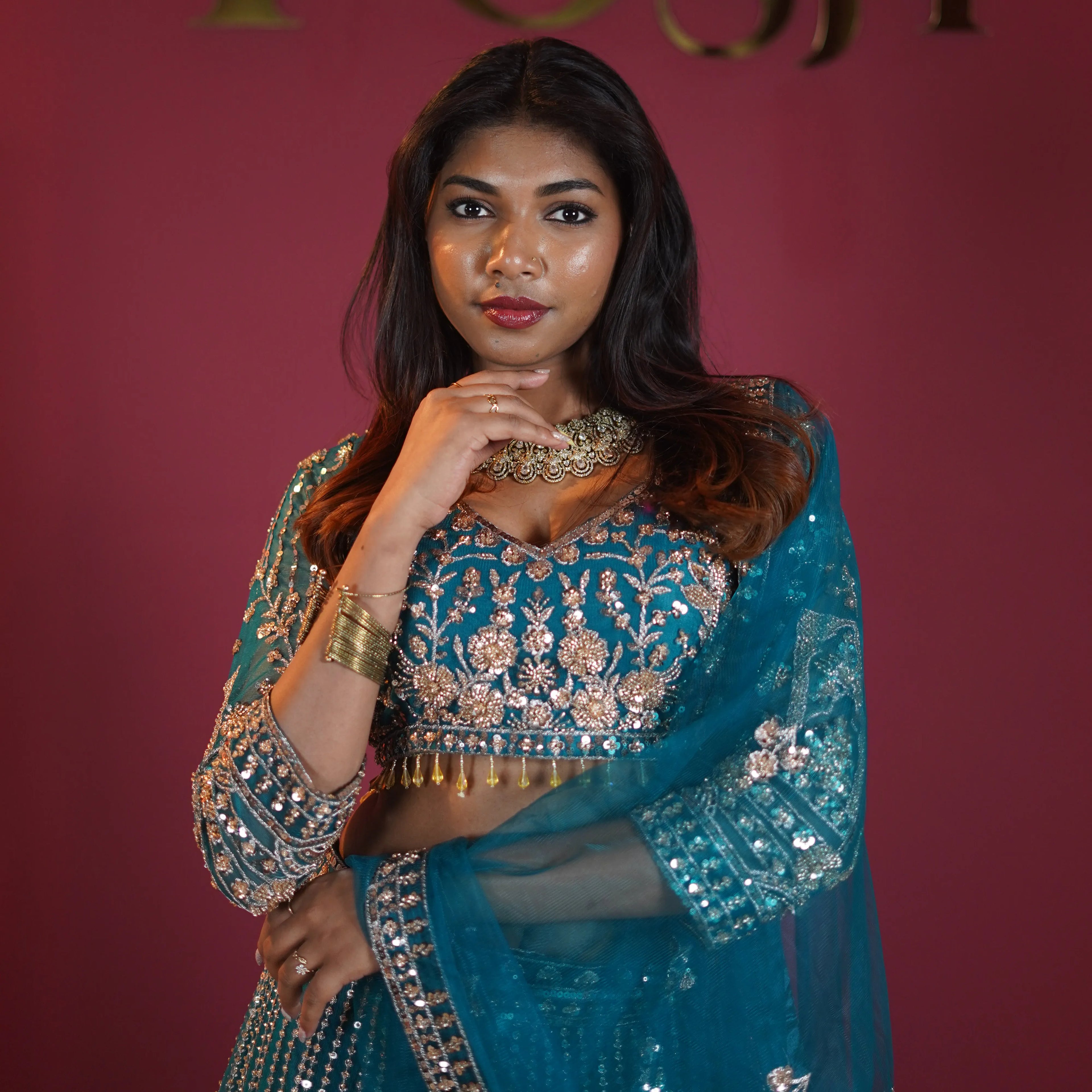 teal green embroidered bridal lehenga with silver zari work available at Posh Wedding Rental Kerala